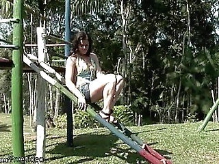 naked t-girl swinging in the park gets covered in chocolate